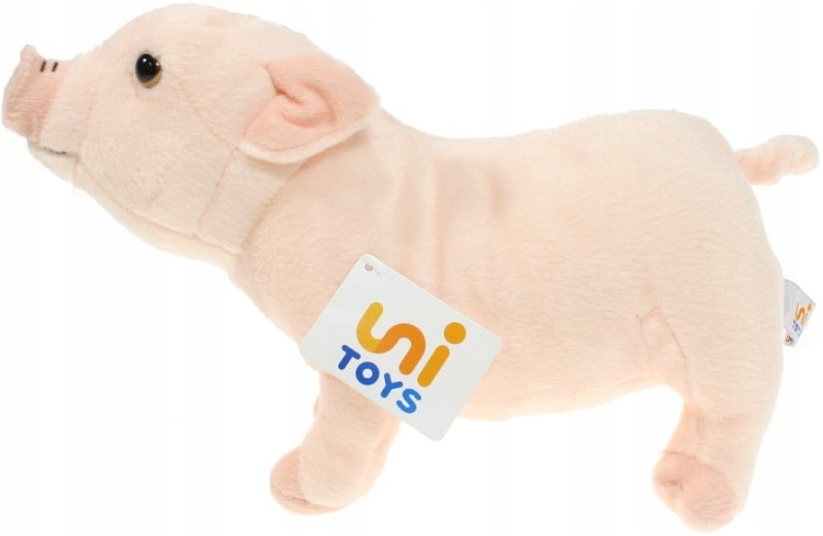 alt="Maskotka świnka stojąca Uni-Toys, zdjęcie z boku – realistyczny pluszak"